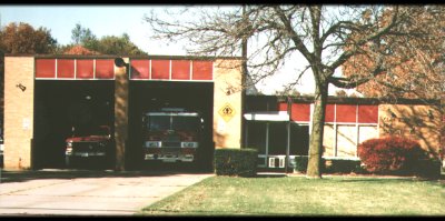 Old school house housing 2 fire trucks